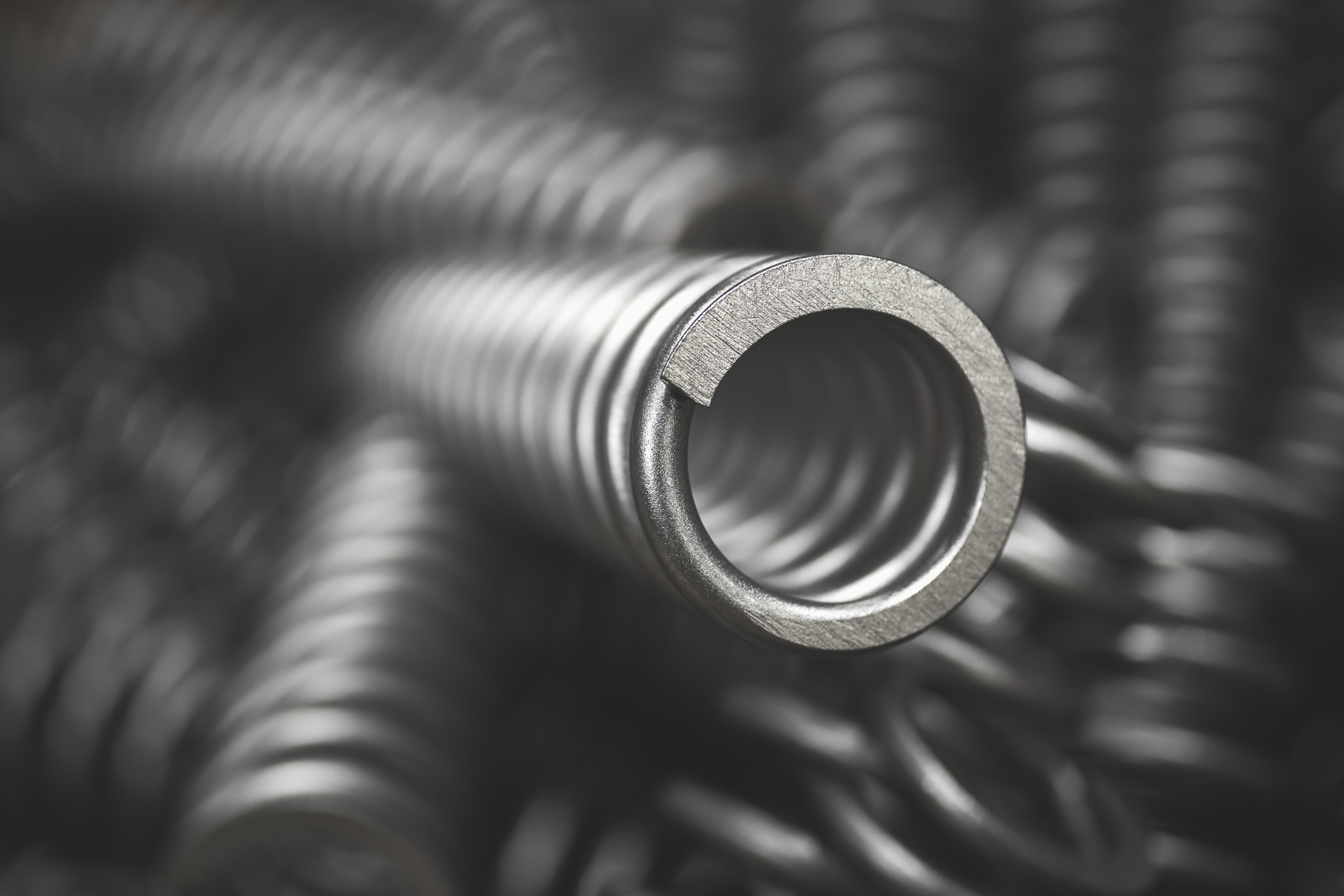 Close-up of a electronic springs in the foreground, with more springs blurred in the background.
